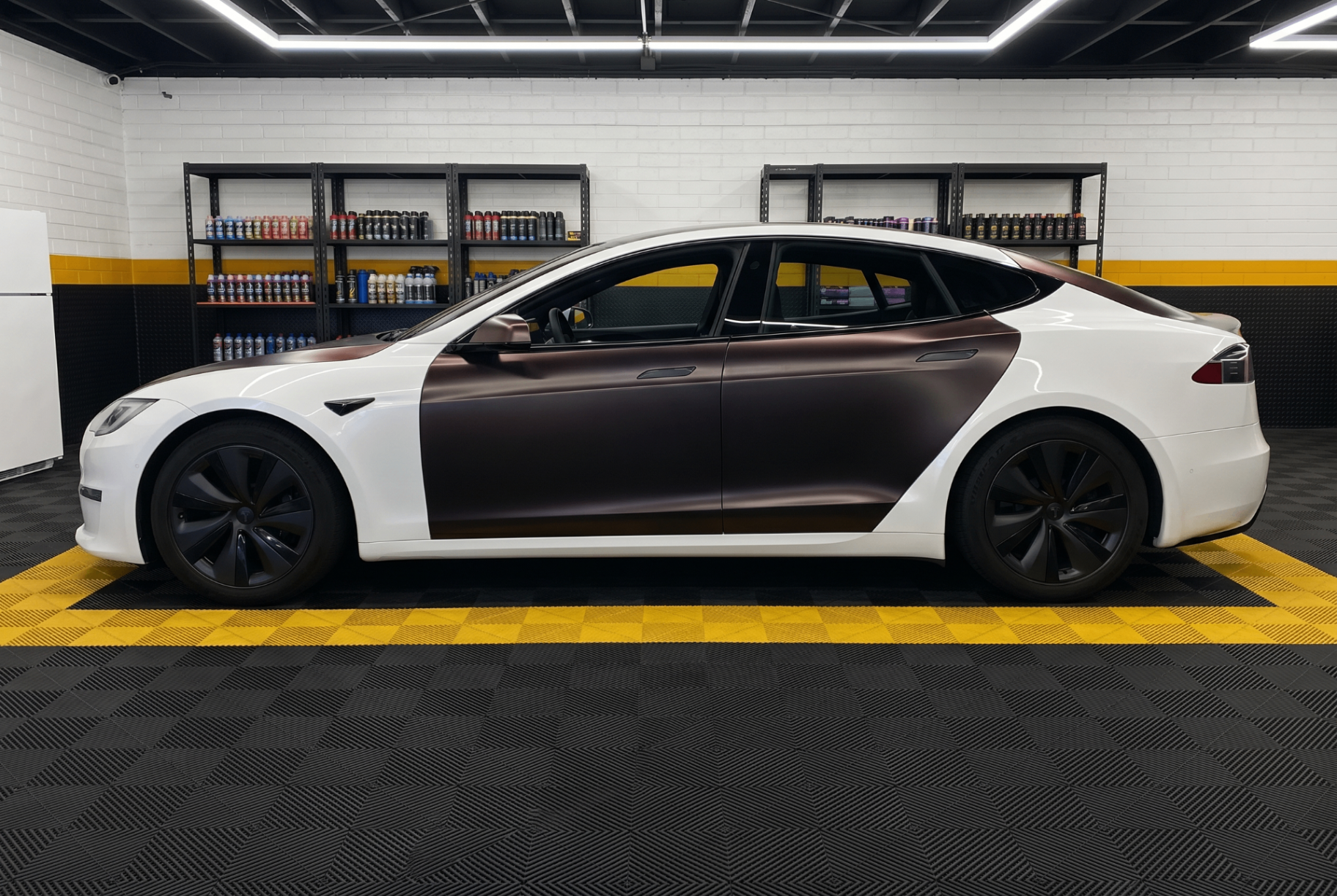 Tesla Model S side profile mid-wrap install at Flex Auto Care Studio